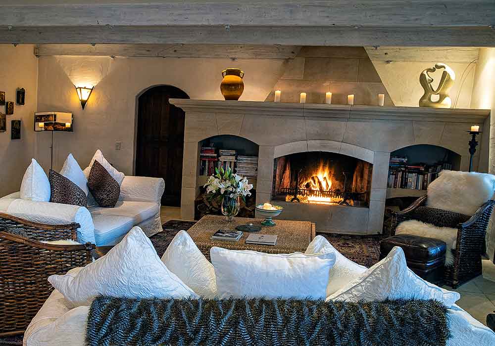 Luxury lodge accommodation - cosy living room with open fireplace